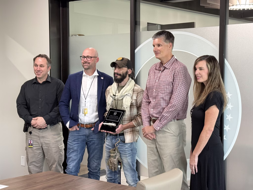 Twin Falls Hero Jordan Salinas Honored by Money Metals With Silver Bullet 3 Photograph of Rep. Rob Beiswenger, Rep. Josh Tanner, Jordan Salinas, Mike Gleason, and Sen. Tammy Nichols.