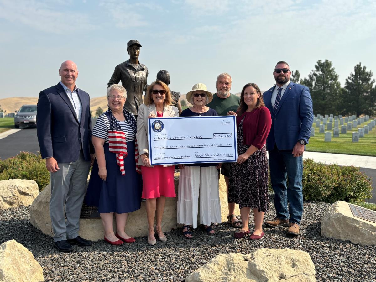 Idaho State Treasurer Julie Ellsworth presents a check to Idaho State Veterans Cemeteries